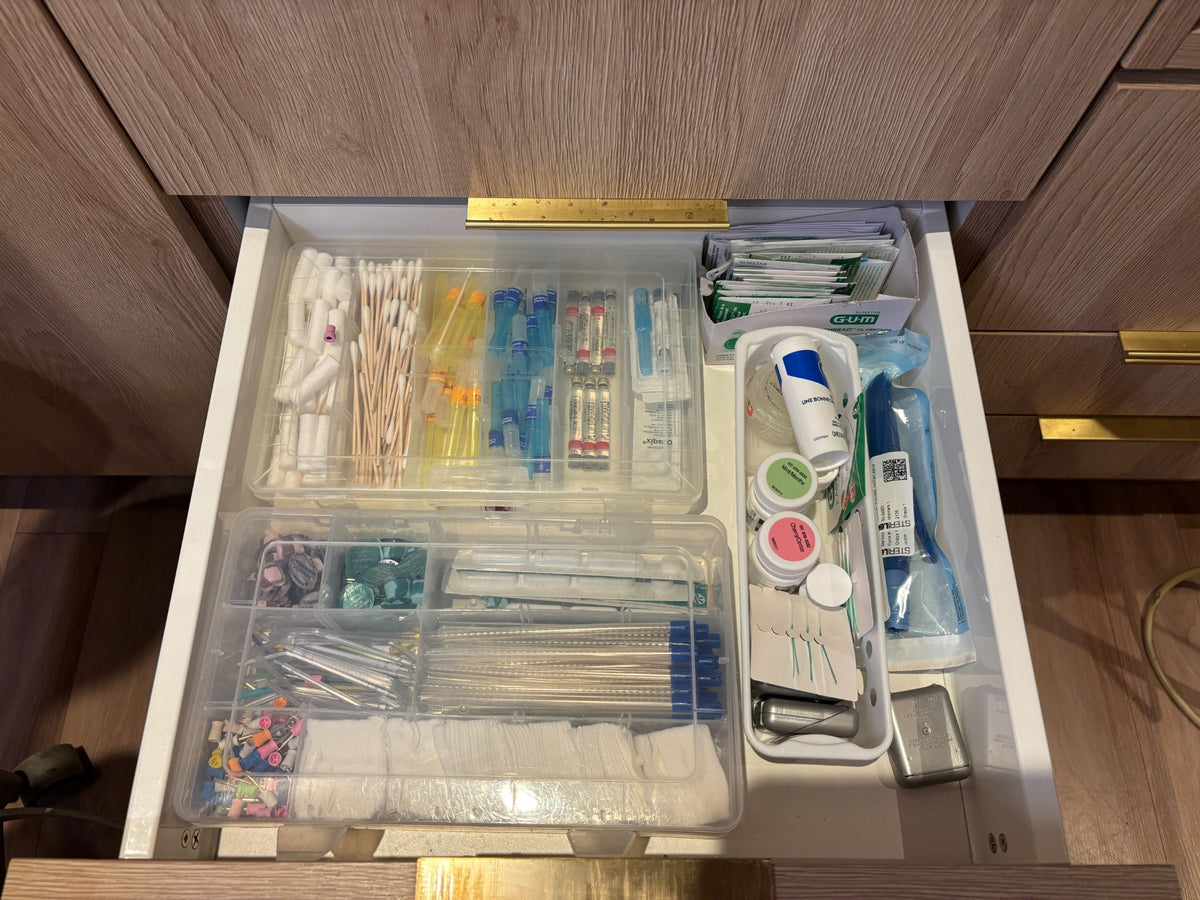 Anesthetic and disposable dental supplies drawer before organization