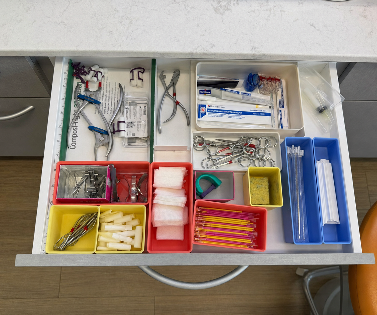 Dental drawer before organization with separate colored trays